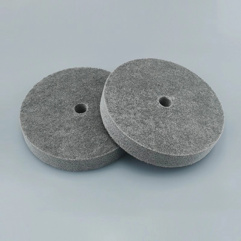 What is a nylon fiber polishing wheel used for?